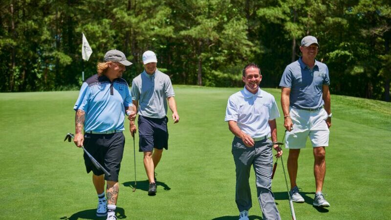4 Golfers on the green