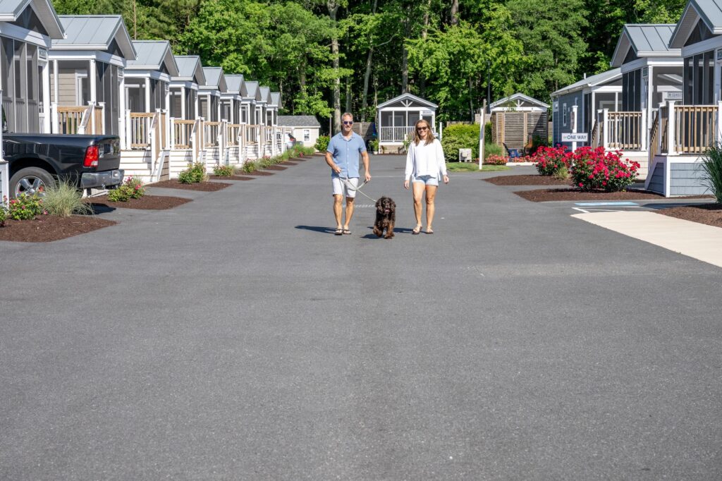 Couple walking dog at Shore Point Cottages